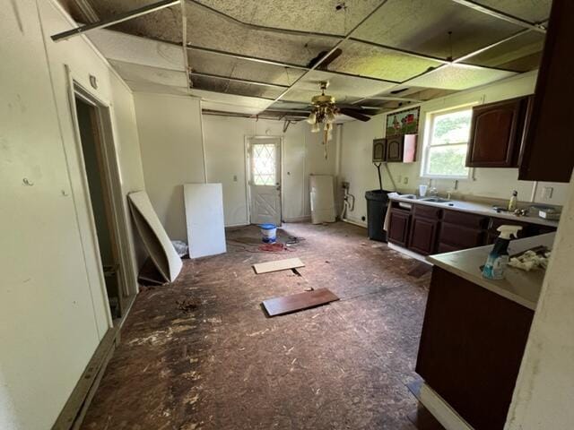 kitchen with dark brown cabinetry and ceiling fan