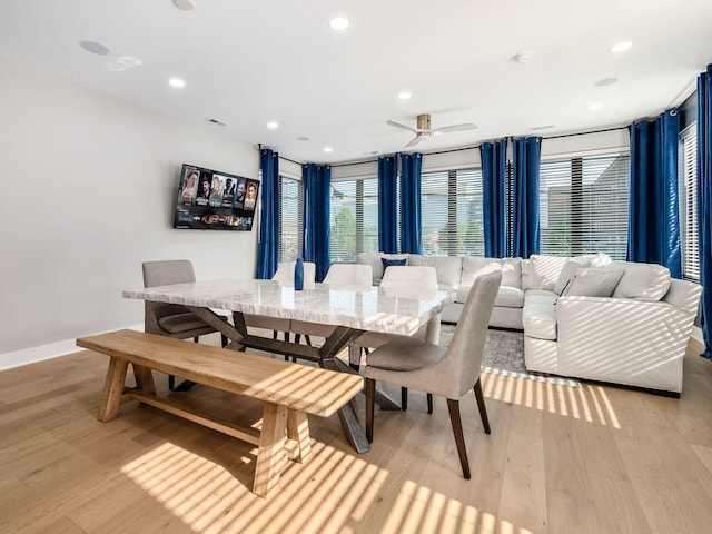 dining room featuring light hardwood / wood-style floors and ceiling fan