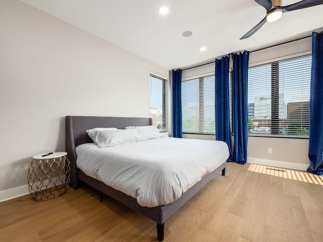 bedroom featuring ceiling fan and light hardwood / wood-style flooring