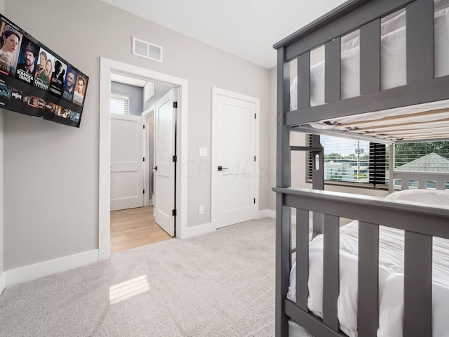 hallway with light carpet