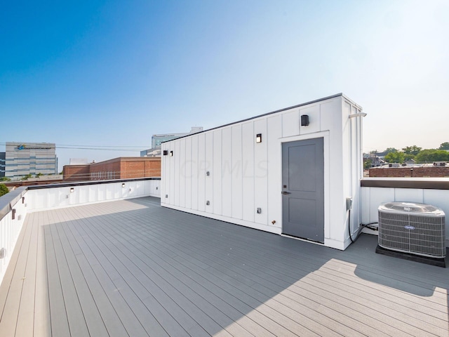 wooden terrace featuring central air condition unit