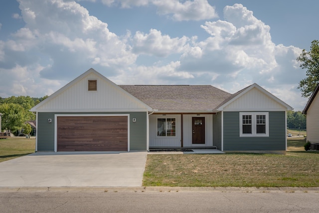 ranch-style house featuring covered porch, a front yard, and a garage