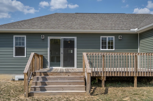 back of house with a wooden deck