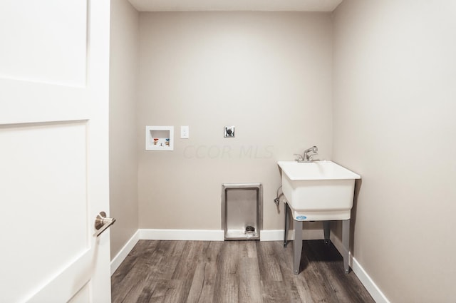 laundry area with hookup for an electric dryer, washer hookup, and hardwood / wood-style flooring