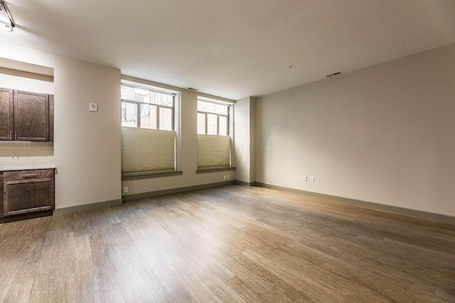 unfurnished room featuring light hardwood / wood-style floors