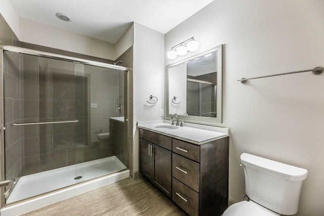 51 N High St Unit 307, Columbus, OH 43215 - bathroom with vanity, a shower stall, and wood finished floors