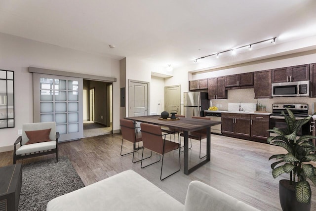 51 N High St Unit 307, Columbus, OH 43215 - dining room with light wood finished floors and baseboards