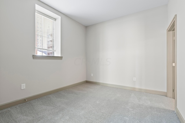 spare room with carpet flooring