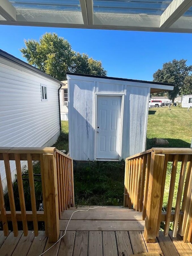 view of outbuilding featuring a lawn