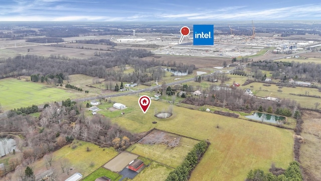 drone / aerial view featuring a water view and a rural view