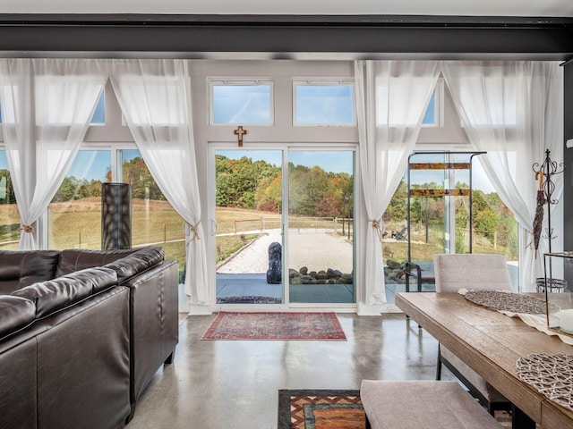 doorway to outside featuring concrete floors