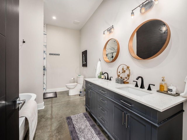 bathroom featuring vanity, toilet, and concrete flooring