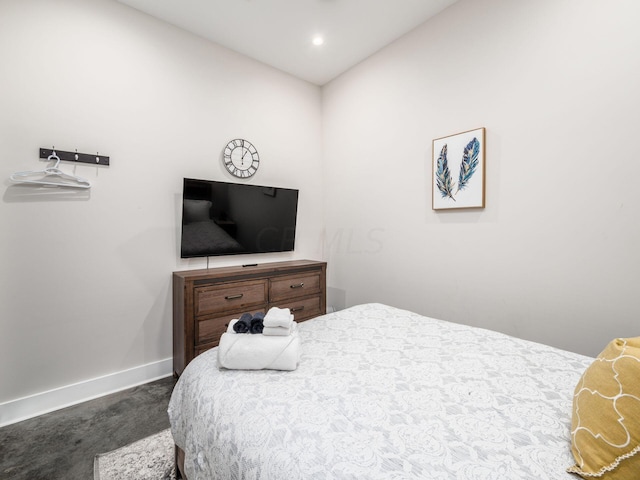 carpeted bedroom with vaulted ceiling