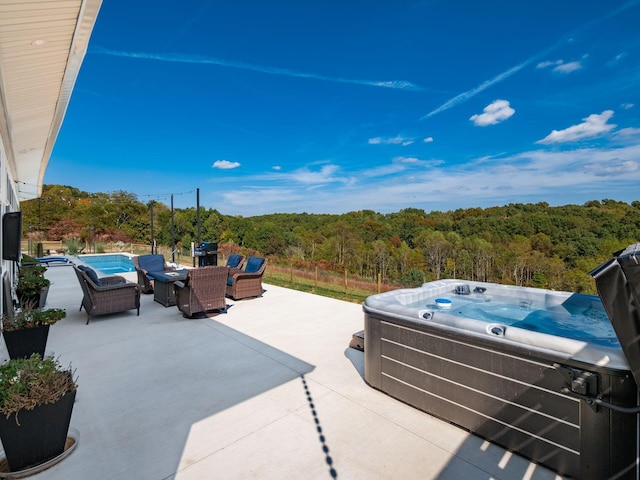 view of patio / terrace featuring a hot tub