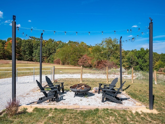 view of yard with a fire pit