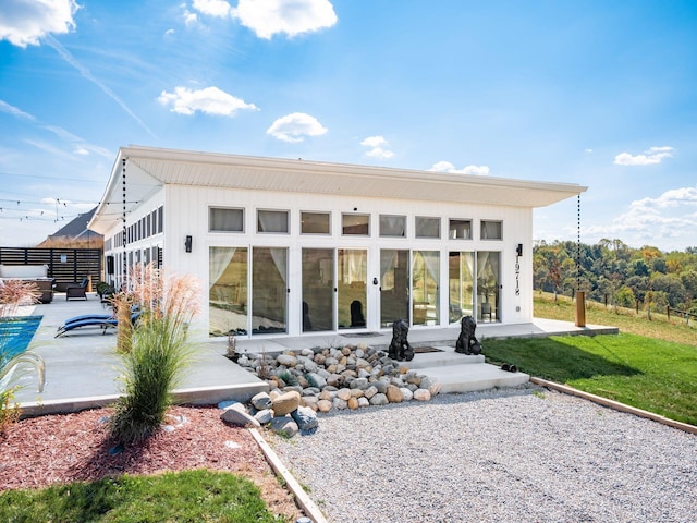 back of house featuring a patio area