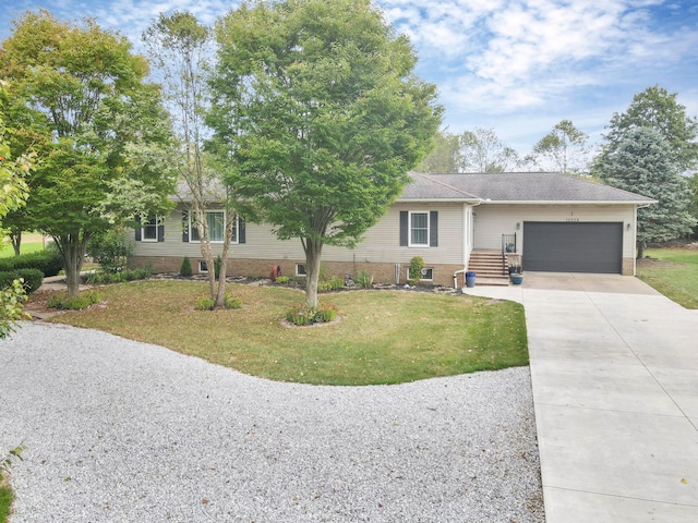 single story home featuring a garage and a front lawn