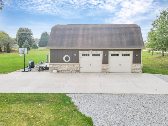 garage with a lawn