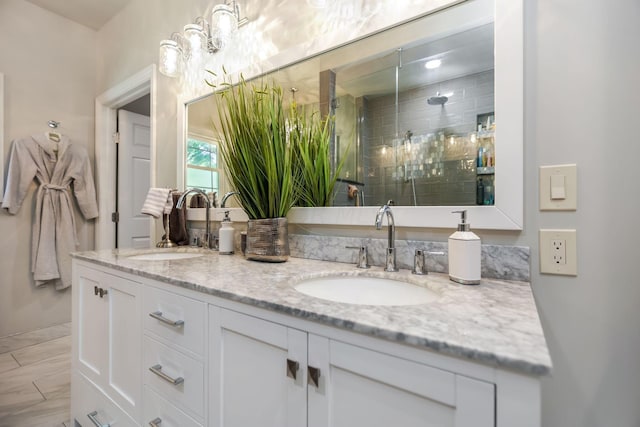 bathroom featuring vanity and an enclosed shower