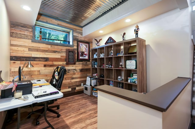 home office featuring wood walls and wood-type flooring