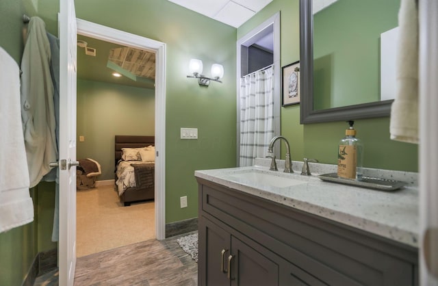 bathroom with hardwood / wood-style floors and vanity