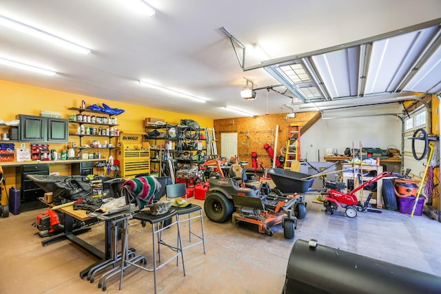 garage with a workshop area and a garage door opener