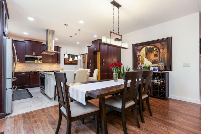 dining area featuring dark hardwood / wood-style floors