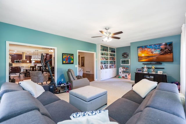 living room featuring ceiling fan and light carpet