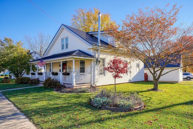 view of front of property with a porch and a front yard