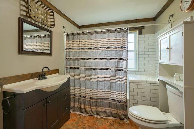 bathroom with vanity, tile patterned flooring, toilet, ornamental molding, and walk in shower