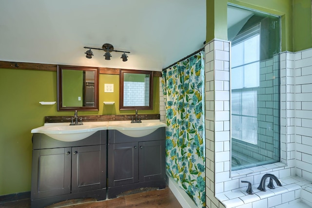 bathroom featuring vanity, hardwood / wood-style flooring, and curtained shower