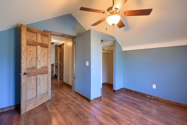 bonus room with ceiling fan, dark hardwood / wood-style floors, and vaulted ceiling