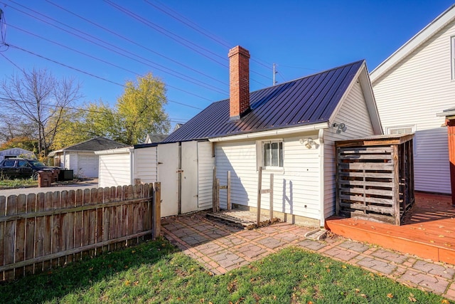 rear view of property with a deck