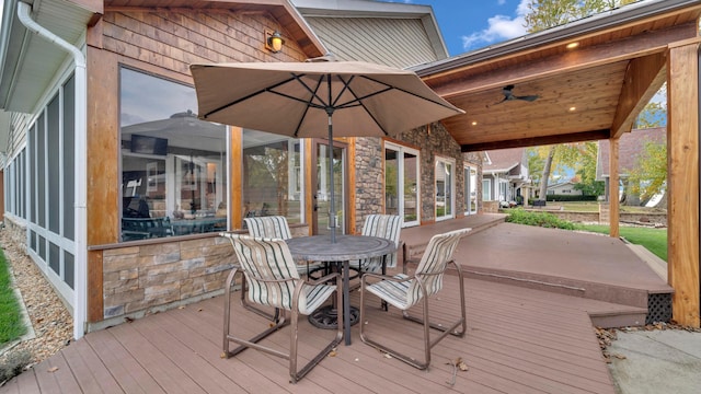 wooden terrace featuring a sunroom