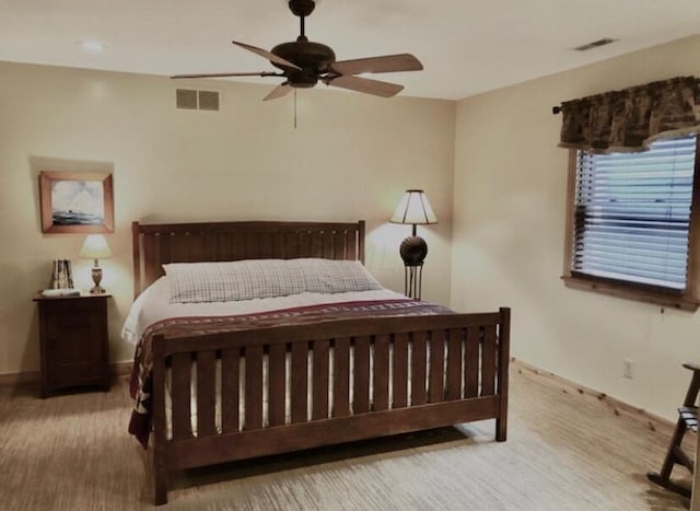 bedroom with ceiling fan and light colored carpet