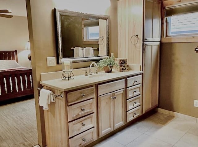 bathroom featuring ceiling fan, tile patterned flooring, and vanity