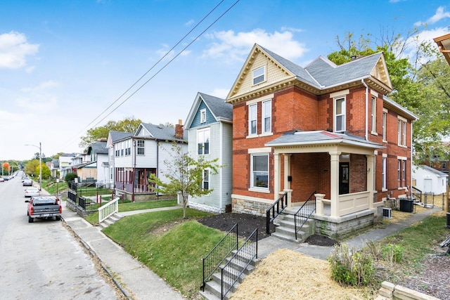 view of front of property featuring covered porch and central AC unit