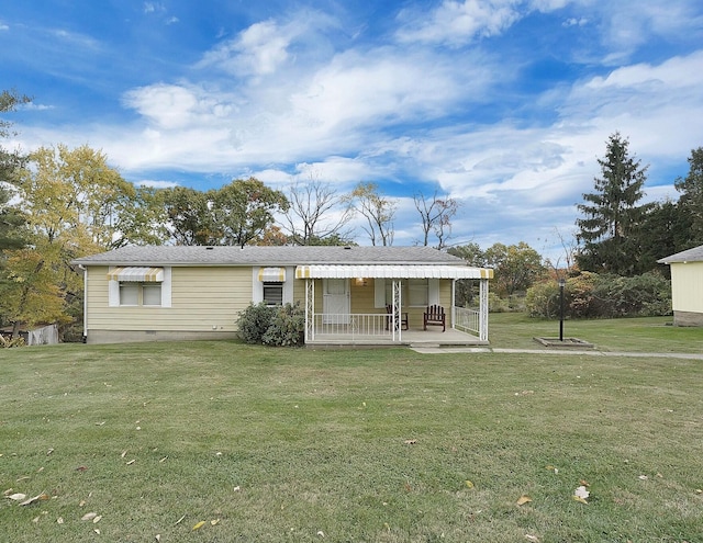 exterior space featuring covered porch and a front yard