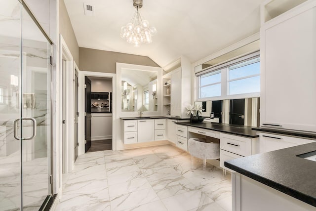 bathroom with vanity, visible vents, marble finish floor, lofted ceiling, and a marble finish shower