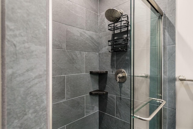 full bath featuring a shower stall