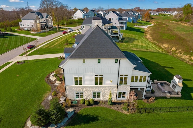 drone / aerial view with a residential view