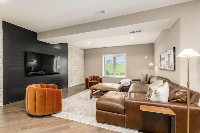 living room featuring visible vents and light wood-type flooring