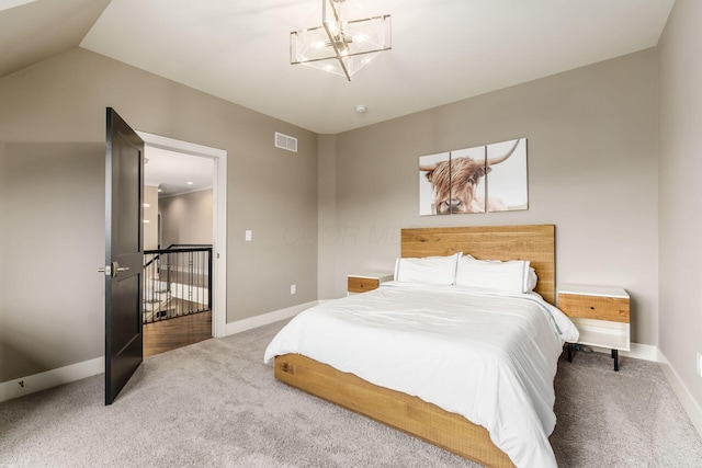 bedroom featuring a notable chandelier, visible vents, baseboards, and carpet floors