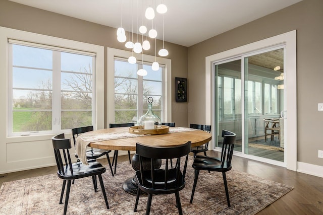 dining area with wood finished floors and baseboards