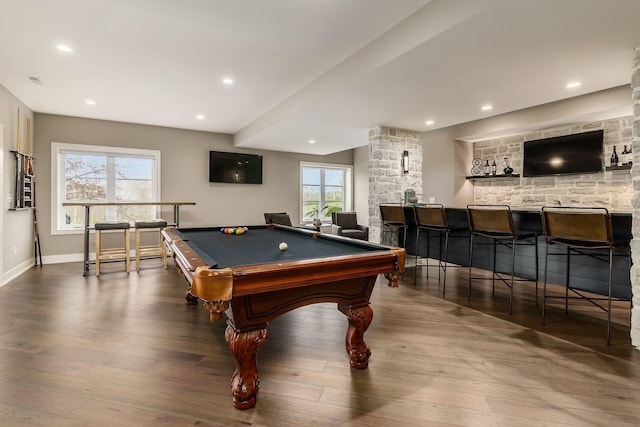 game room with a wealth of natural light, billiards, wet bar, and wood finished floors