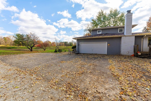 view of side of property featuring a garage