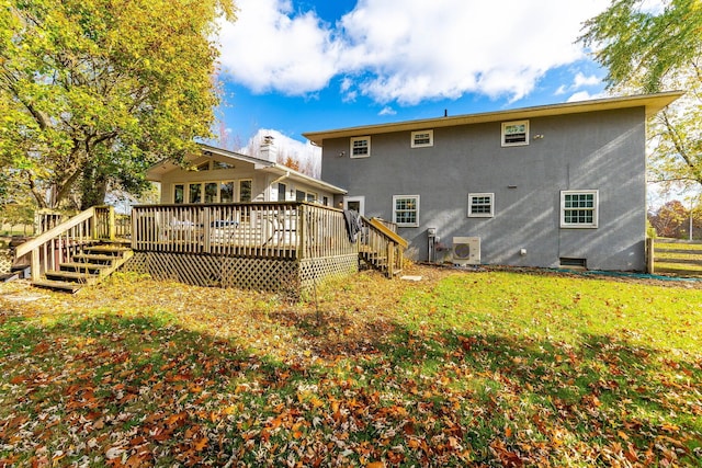 back of house with a lawn, ac unit, and a deck