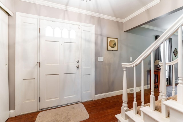 foyer entrance with crown molding and dark wood-type flooring