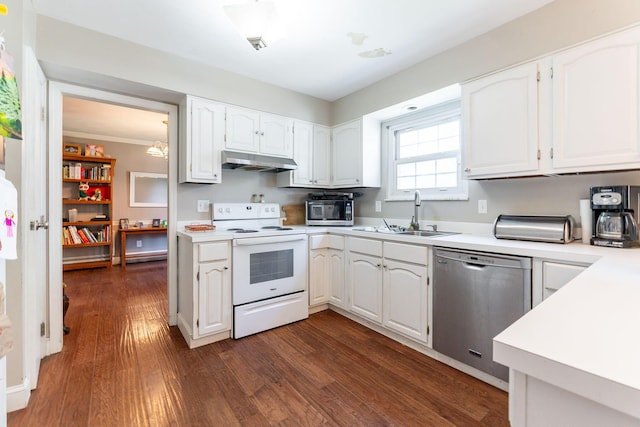 kitchen featuring sink, stainless steel appliances, dark hardwood / wood-style floors, crown molding, and white cabinets