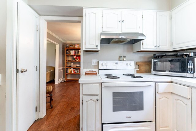 kitchen featuring dark wood-type flooring, ventilation hood, electric stove, ornamental molding, and white cabinetry